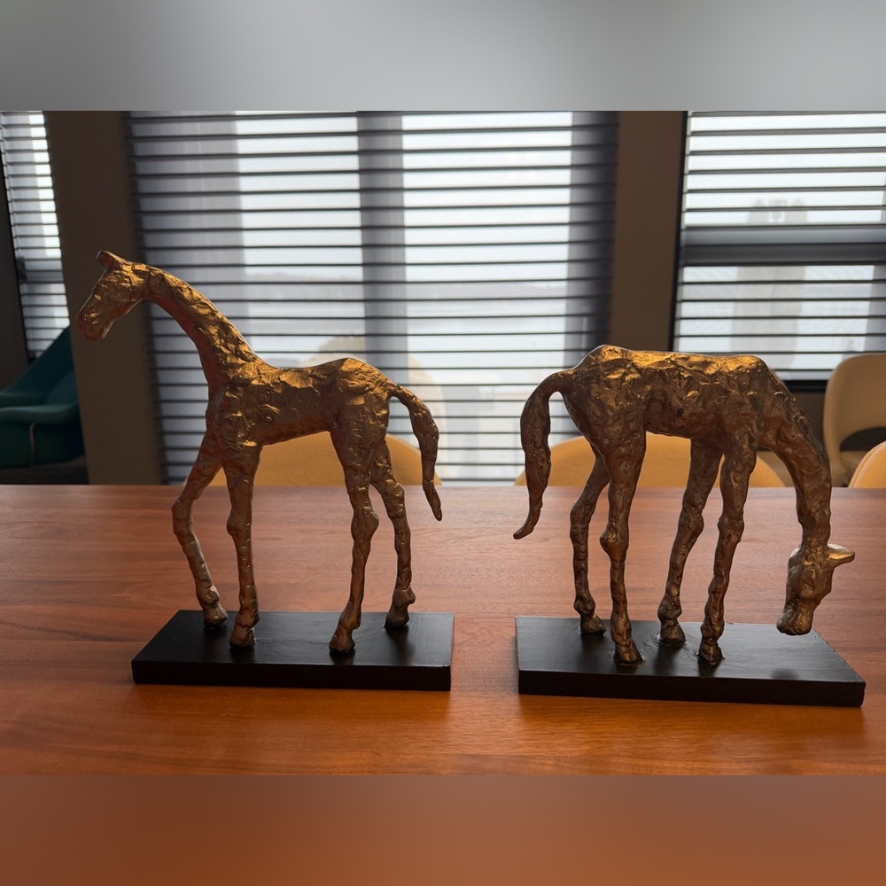2 Uttermost Silvertoned Horse Sculptures. Solid on black painted base. 12” & 10”